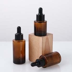 empty amber glass serum bottle with dropper