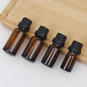 amber essential oil glass bottle with black screw cap