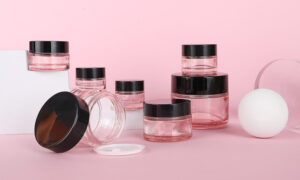 pink glass cream jar bottle with blak lid