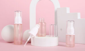 pink glass cosmetics pump bottle