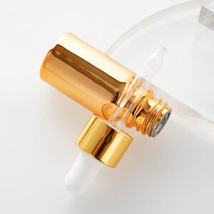 gold color skincare glass serum bottle