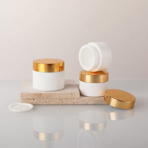 opal white glass cosmetic jar with gold lid