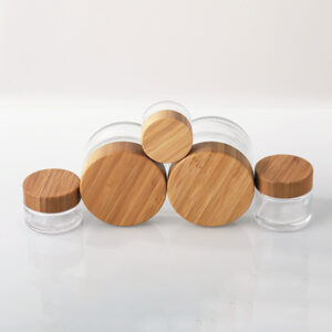 transparent glass cosmetic jar with bamboo lid