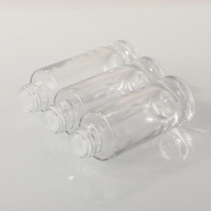 round glass cosmetic serum bottle