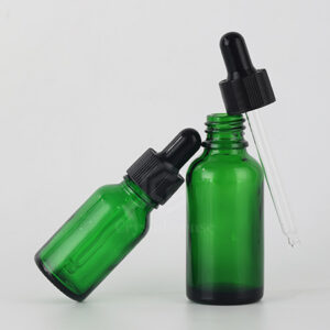 green essential oil bottle