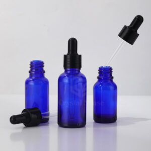 blue glass essential oil bottle