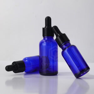 blue glass essential oil bottle