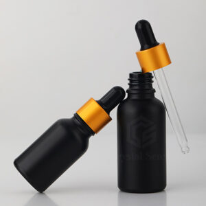 black essential oil bottle