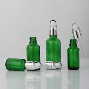 essential oil green glass bottle