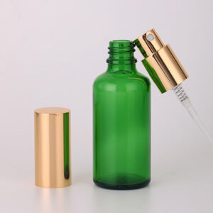 green glass round spray bottle