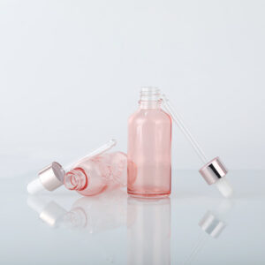 pink essential oil glass dropper bottle