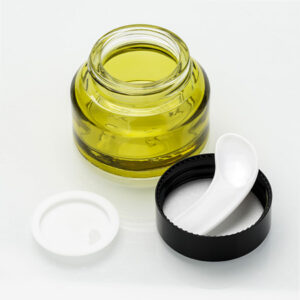 empty slanted shoulder green glass cosmetic jar