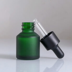 green cosmetic glass bottle