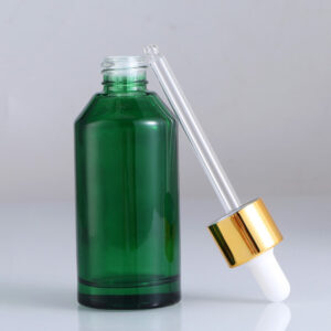 green glass facial oil bottle